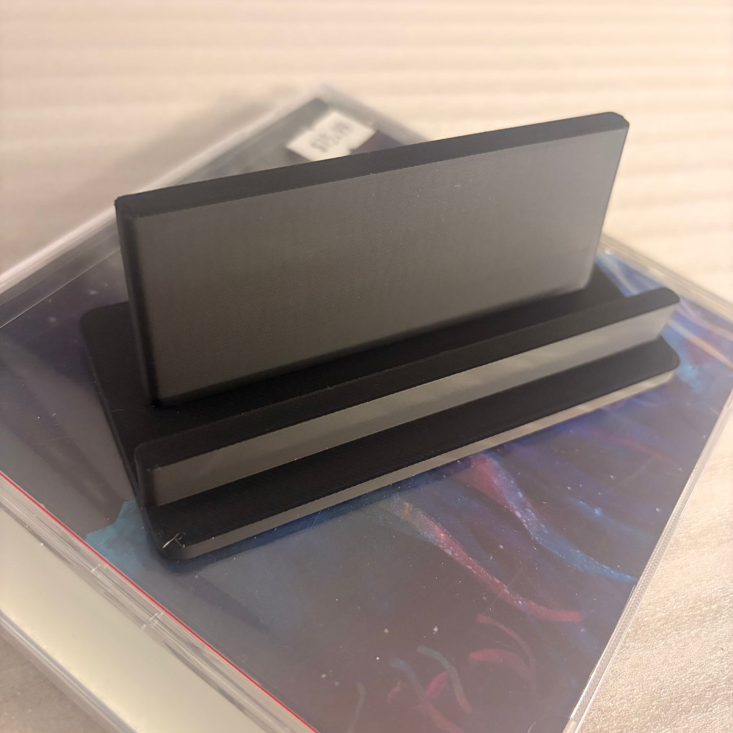 UNIVERSAL CD JEWEL CASE DISPLAY STAND – DARK ART APPAREL EXCLUSIVE