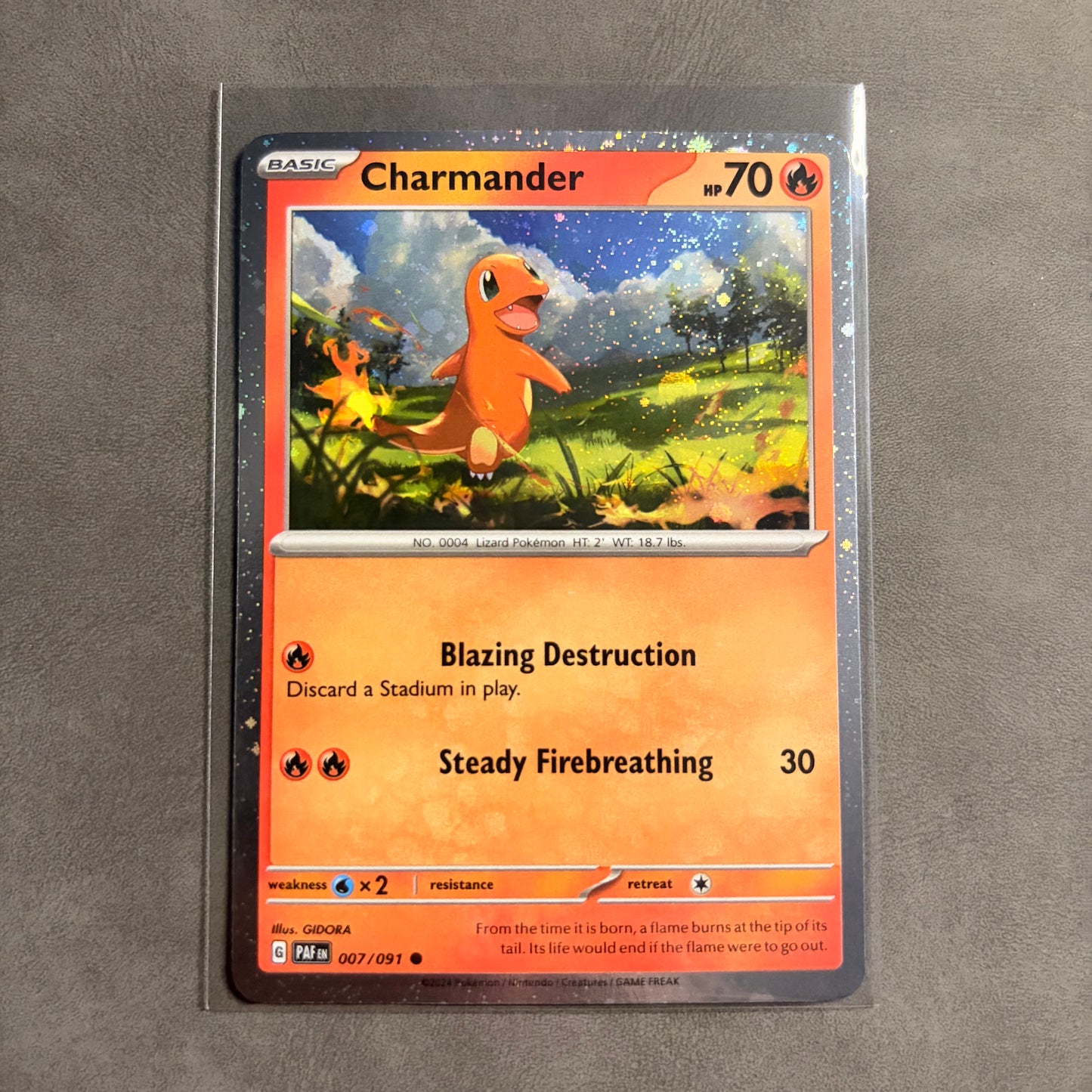 CHARMANDER 007/091 – PALDEAN FATES – COSMOS HOLO – NM